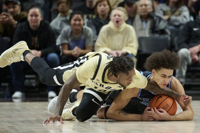 Duke's Tyrese Proctor, right, and Purdue's David Jenkins Jr. battle for a loose ball during Sunday's game. 