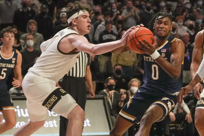 Wakw Forest's Jake LaRavia battles Notre Dame's Blake Wesley (0) for the ball during the Demon Deacons; 79-74 win Saturday in Winston-Salem, N.C. 