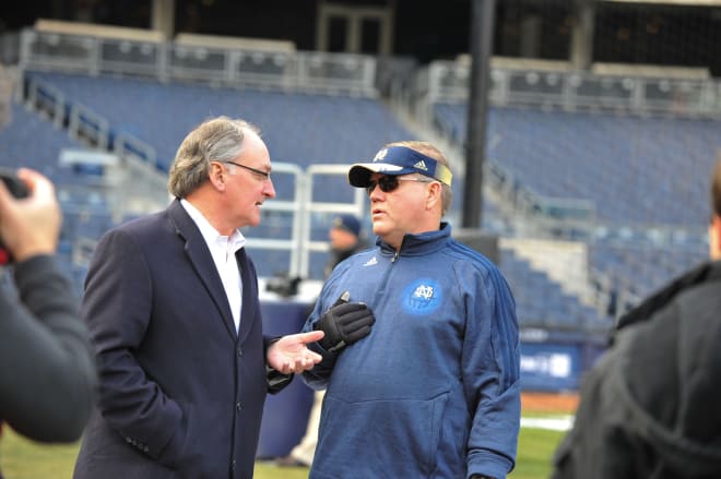 Notre Dame director of athletics Jack Swarbrick (left) and football head coach Brian Kelly (right)