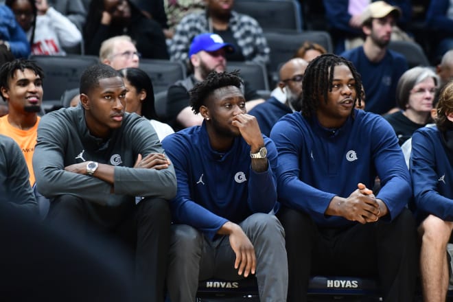 Jay Heath (center), watched Georgetown's two games this season in street clothes.  No More.  