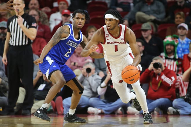 Ricky Council IV drives around a defender during the Razorbacks' win over UNC Asheville.