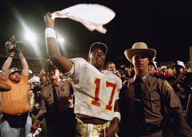 Charlie Ward salutes the fans after FSU's victory against Nebraska in the Orange Bowl to claim the 1993 national championship.