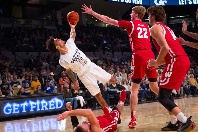 Devoe takes a spill after a collision on the court 