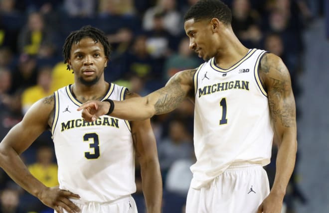 Zavier Simpson and Charles Matthews played smothering defense Saturday in a win over Florida.