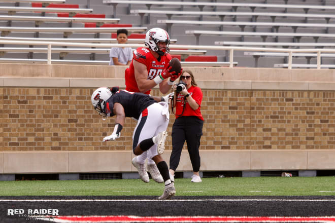 TE Mason Tharp snatches the ball over a defender during Texas Tech's annual Spring Game.