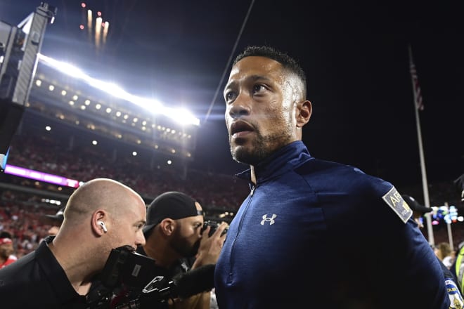 Notre Dane heads coach Marcus Freeman walks to the locker room after his No. 5 Irish succumbed to second-ranked Ohio State on the road Saturday night.