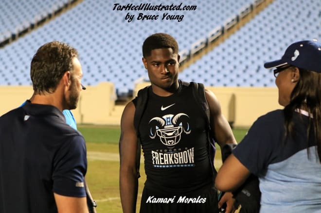 Kamari Morales and his mother speak with Larry Fedora after the Freak Show.