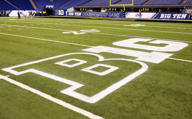 A Big Ten logo on the field before the Big Ten Conference football championship game between the Iowa Hawkeyes and the Michigan State Spartans at Lucas Oil Stadium.