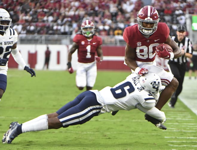 Utah State Aggies defensive back Gurvan Hall Jr. (6) tackles Alabama Crimson Tide wide receiver Kobe Prentice (80) in the first half at Bryant-Denny Stadium. Photo | Gary Cosby Jr.-USA TODAY Sports