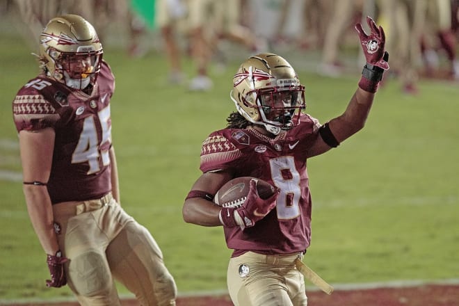 FSU running back Treshaun Ward celebrates a touchdown earlier this season with tight end Preston Daniel.