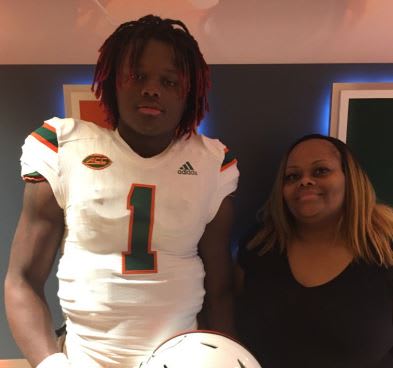 Johnson and his mother during his UM official visit in January
