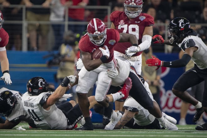 Alabama Crimson Tide running back Brian Robinson Jr. (4) runs through the Cincinnati Bearcats line during the second quarter during the 2021 Cotton Bowl college football CFP national semifinal game at AT&T Stadium. Photo | USA TODAY