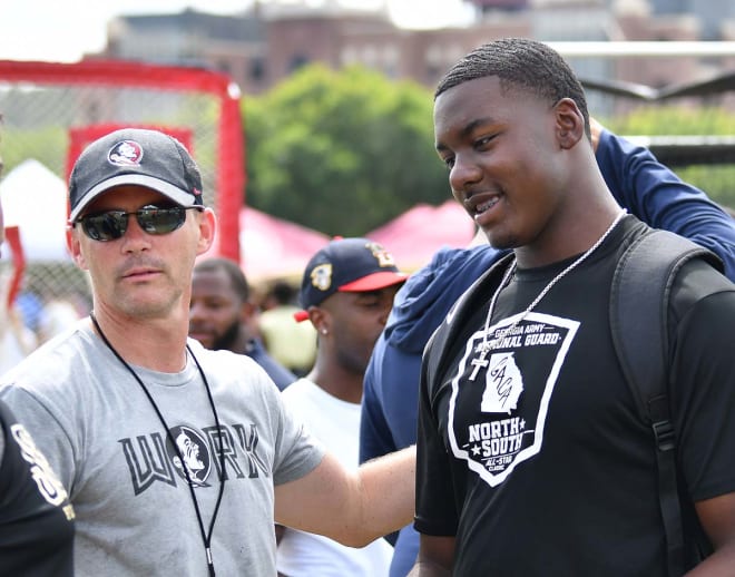 Five-star defensive end Mykel Williams spends time with FSU coach Mike Norvell at Sunday's Mega Camp.