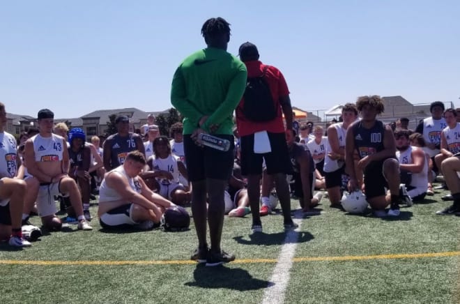 Football University director of football development and brand marketing speaking with athletes during the FBU Texas Showdown Sunday at Prestonwood Christian Academy.