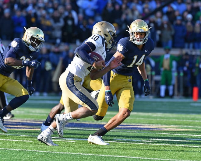 Freshman safety Kyle Hamilton and the Irish defense kept quarterback Malcolm Perry and the Navy offense at bay while recovering four fumbles. This play by Hamilton was a one-yard loss by Perry on fourth-and-one.