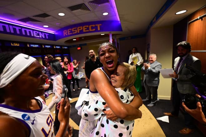 LSU forward Angel Reese and head coach Kim Mulkey hug after the Lady Tigers' NCAA Baton Rouge Regional second-round win over Michigan Sunday in the Pete Maravich Assembly Center.