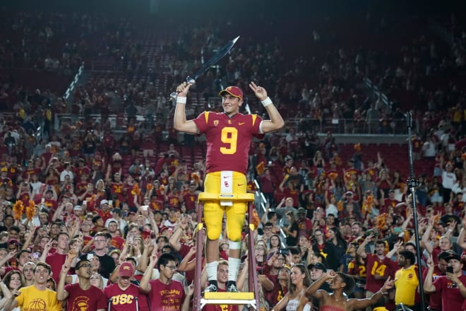 Freshman quarterback Kedon Slovis leads the USC band after passing for 377 yards and 3 TDs.