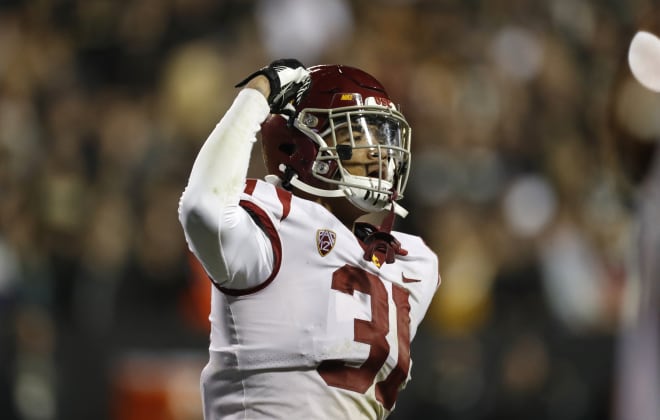 Outside linebacker Hunter Echols celebrates a key stop during USC's comeback against Colorado on Friday night.