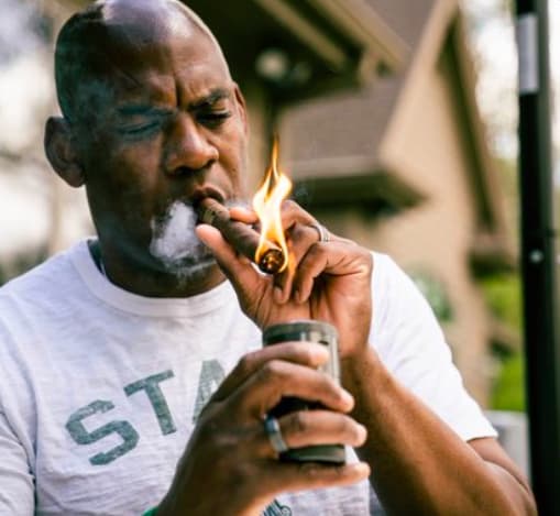 Mel Tucker and his cigar.