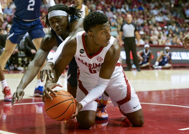 Longwood Lancers forward Leslie Nkereuwem (0) and Alabama Crimson Tide guard Jaden Bradley (0) go for the ball during first half at Coleman Coliseum. Photo | Marvin Gentry-USA TODAY Sports