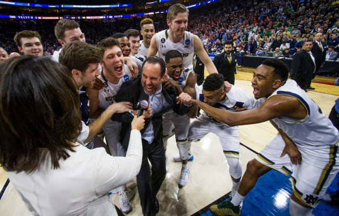 Outgoing Notre Dame men's basketball coach Mike Brey (center) defines his legacy by his relationships with his players.