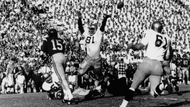 Alan Page (81) and Jim Lynch (61) led the impregnable  1966 defense that would help win the national title.