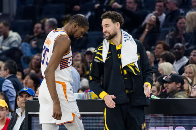 Phoenix Suns forward Kevin Durant (35) and Golden State Warriors guard Klay Thompson (11) talk during the first half at Chase Center. Mandatory Credit: John Hefti-USA TODAY Sports