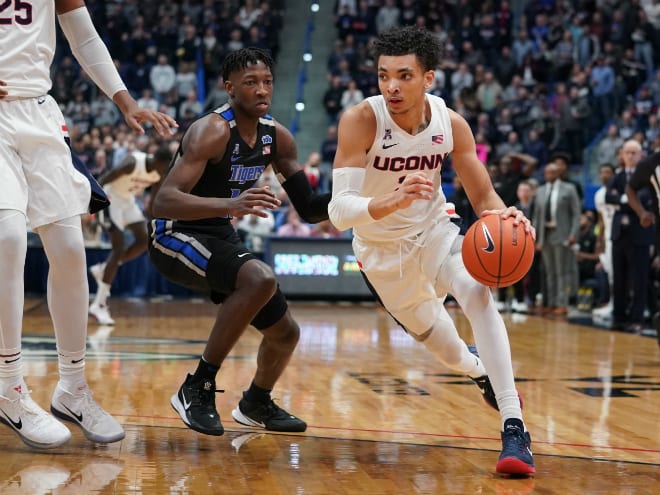 Connecticut guard James Bouknight (2) drives against Memphis Tigers guard Damion Baugh at XL Center.