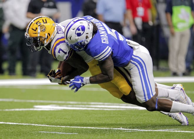 LSU wide receiver D.J. Chark catches a pass against BYU defensive back Dayan Ghanwoloku in last weeks game