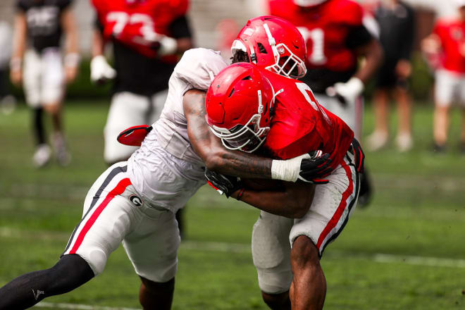 Smael Mondon brings down Branson Robinson during a practice early this spring.