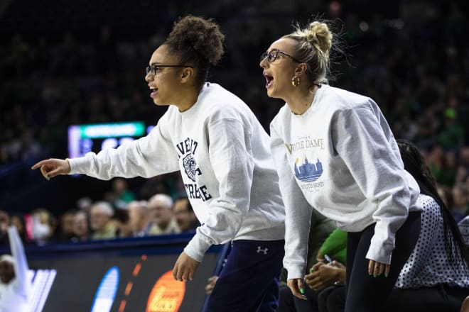 Injured guards Olivia Miles (left) and Dara Mabrey tried to lead from the sideline during Notre Dame's NCAA Tournament run.