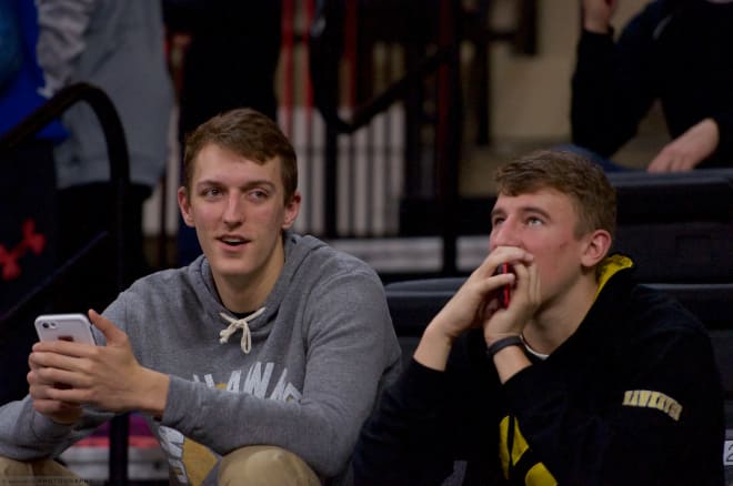 Jack Nunge (left) is even more excited after watching Iowa knock off Ohio State. 