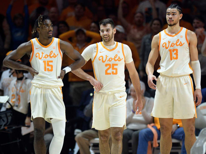 Tennessee guards Jahmai Mashack (15), Santiago Vescovi (25) and forward Olivier Nkamhoua (13) take a breather during the Vols' 75-57 win over Arkansas on Tuesday.