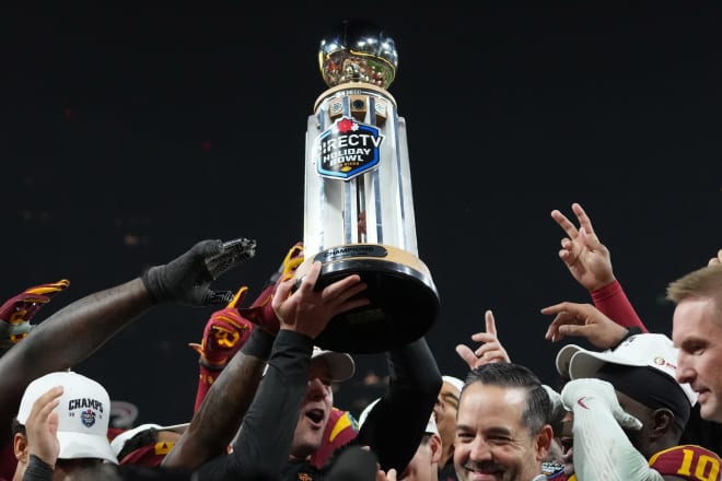Lincoln Riley holds up the Holiday Bowl trophy after USC's 42-28 win over Louisville on Wednesday.