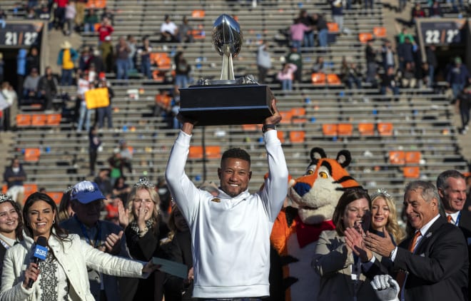 Notre Dame coach Marcus Freeman hoists the Sun Bowl trophy after his team's 40-8 victory over Oregon State.