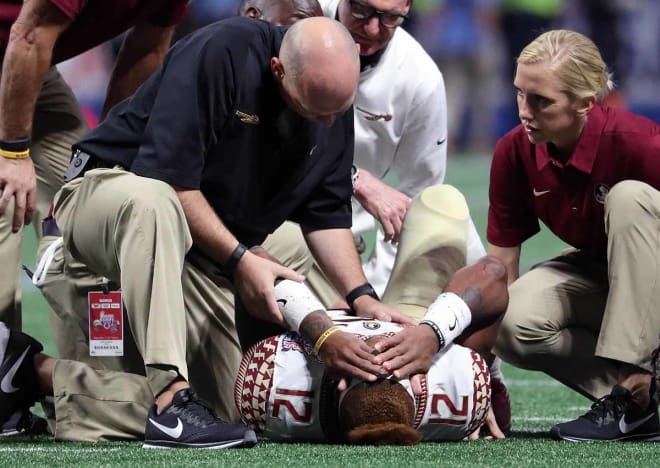 An emotionally distraught Deondre Francois laid steady while Florida State's athletic training staff assessed his injury on Saturday.