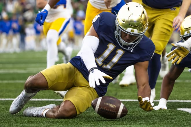 Ramon Henderson recovers a fumble for Notre Dame in an October 2023 game against Pittsburgh.