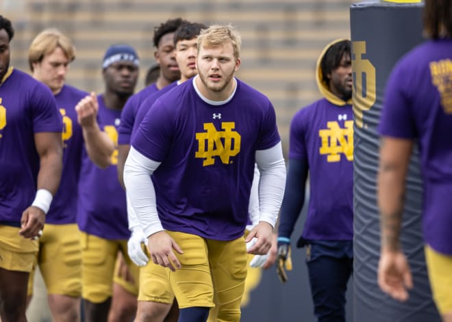 Notre Dame defensive tackle Rylie Mills leads the Irish defensive linemen through drills ahead of the Blue-Gold Game.