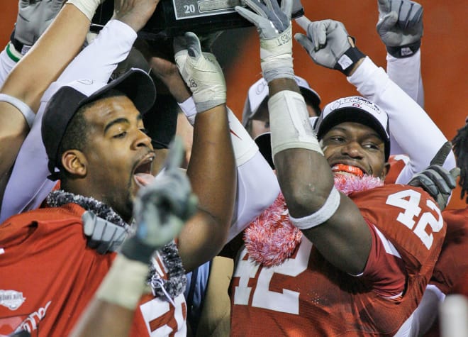 Calvin Thibodeaux and Rufus Alexander celebrate a Big 12 Championship in Kansas City during the 2006 season 
