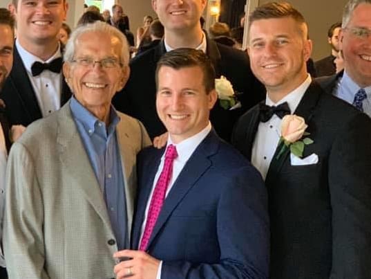  Smith (far right) is pictured here with Bobby Riddell and John Nine at a wedding in 2019. 