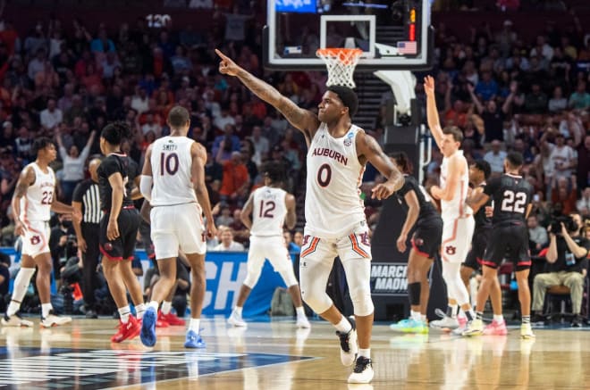 K.D. Johnson celebrates an Auburn basket.