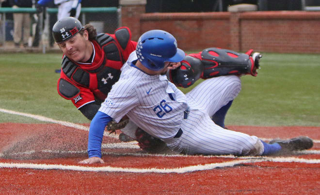 Kentucky's Luke Heyer slid home safely ahead of the tag from catcher Zayne Willems on a squeeze bunt play in the sixth inning of the Wildcats' 11-6 win over Texas Tech on Saturday at Cliff Hagan Stadium.