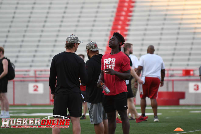 Nebraska commit Ernest Hausmann talking with coach Barrett Ruud at FNL No. 1