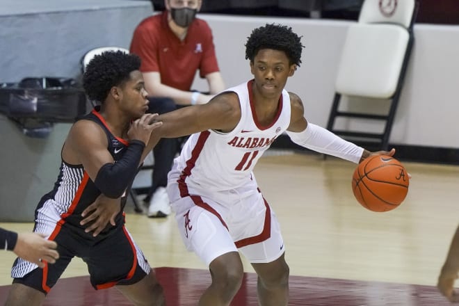 Alabama Crimson Tide guard Joshua Primo (11) controls the ball against Georgia Bulldogs guard Sahvir Wheeler (2) during the first half at Coleman Coliseum. Photo | Imagn