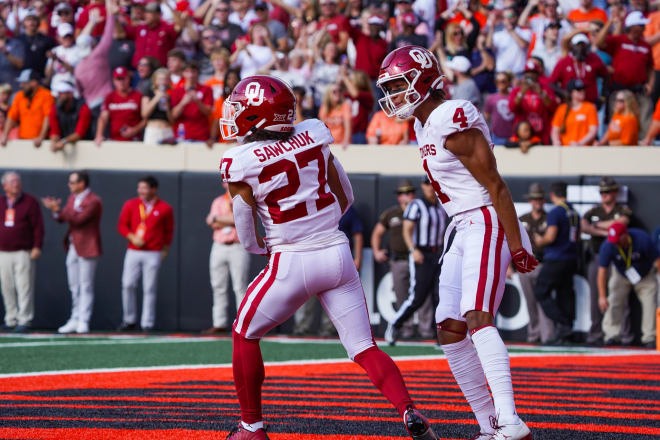 Gavin Sawchuk celebrates with teammate Nic Anderson after running for a 64-yard touchdown against Oklahoma State earlier this month (Photo by Parker Thune).