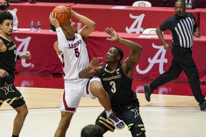 Alabama Crimson Tide guard Jaden Shackelford (5) drives against against Vanderbilt Commodores guard Maxwell Evans (3) during the second half at Coleman Coliseum. Photo | Imagn