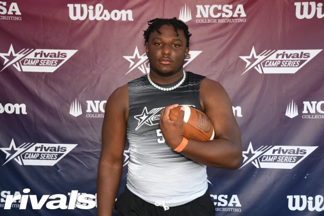 Stone poses for a photo at the Rivals Camp in Florida on Sunday