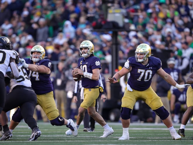 Notre Dame quarterback Sam Hartman, pictured with the football, was well-protected against Wake Forest.