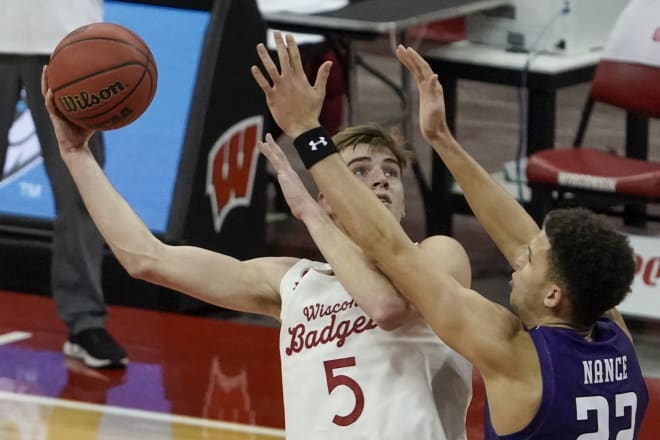 Wisconsin's Tyler Wahl shoots over Northwestern's Pete Nance during the second half of the Badgers' 68-52 victory.