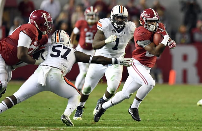 Alabama Crimson Tide running back Joshua Jacobs (25) carries up the field against the Auburn Tigers during the fourth quarter at Bryant-Denny Stadium. Alabama defeated the Auburn Tigers 30-12. Photo | USA Today
